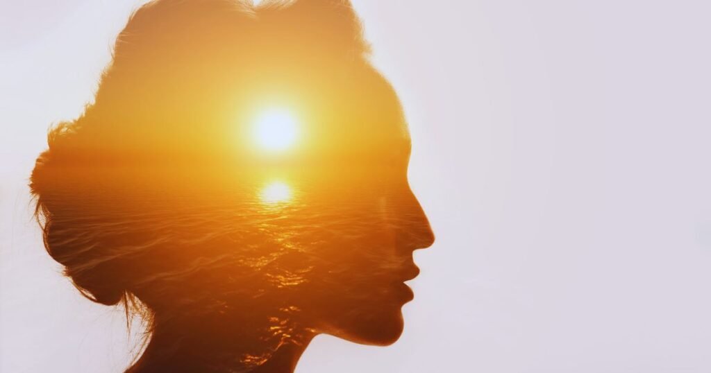 Woman silhouette with sunset reflecting inner emotional pain and healing