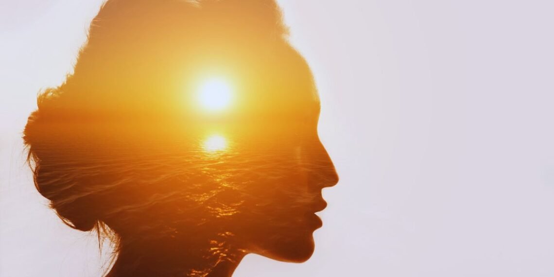 Woman silhouette with sunset reflecting inner emotional pain and healing