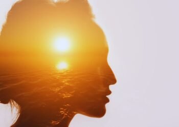 Woman silhouette with sunset reflecting inner emotional pain and healing