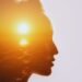 Woman silhouette with sunset reflecting inner emotional pain and healing